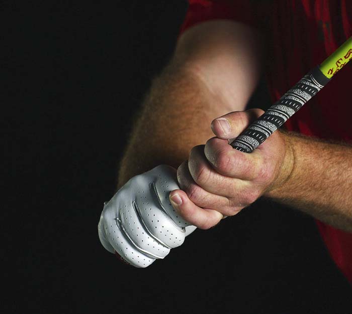 demonstration of proper grip for driving a golf ball