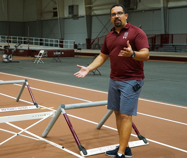 Karim Abdel Wahab teaching hurdle drills