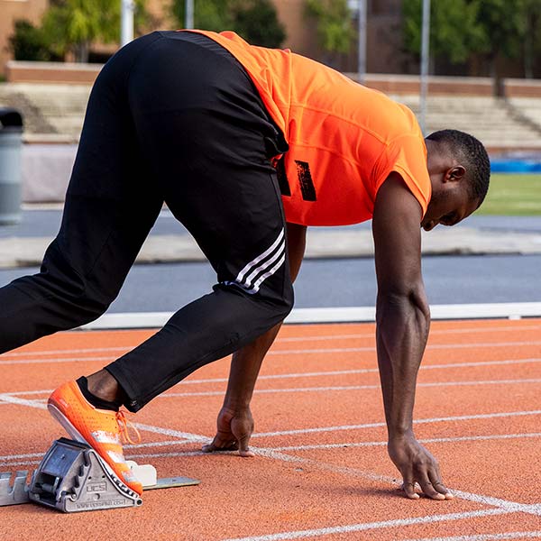 sprinter in the blocks demonstrating the correct sprinting technique