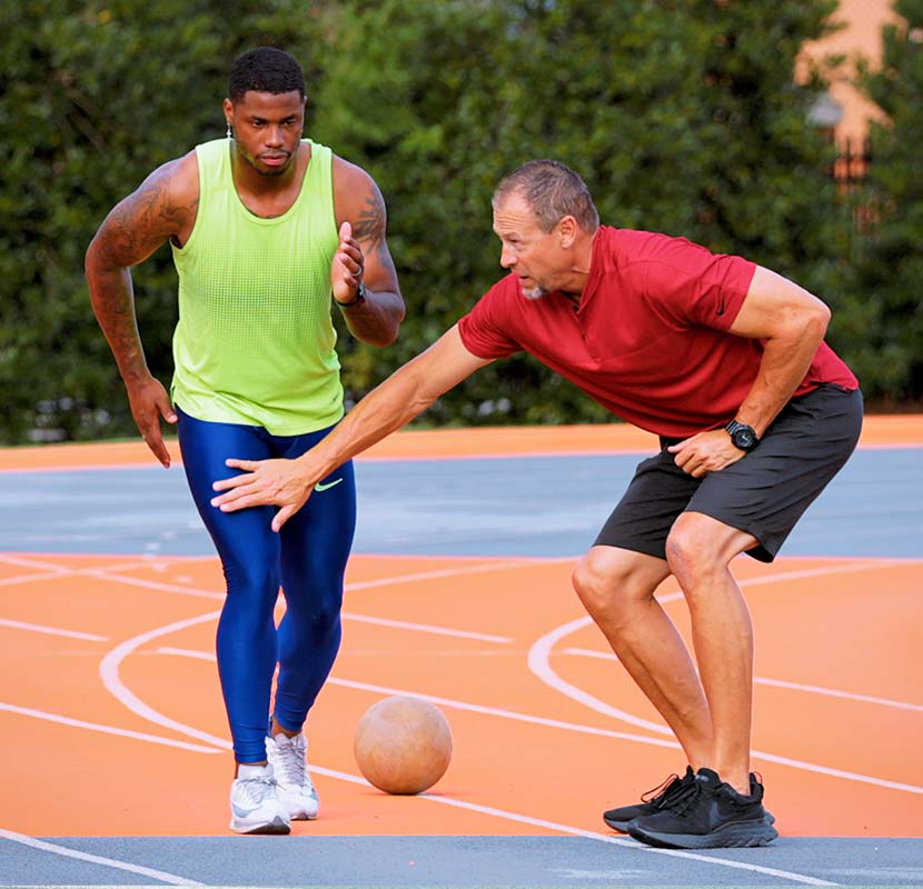 Coach Harnden teaching proper sprinting technique.