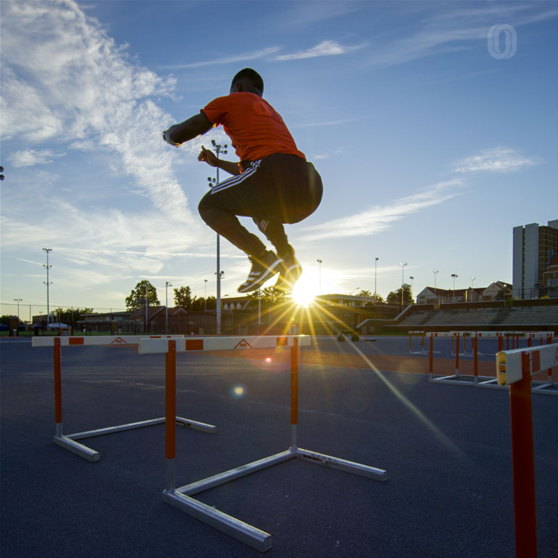 olympic sprinter performing hurdle hops to improve ground contact