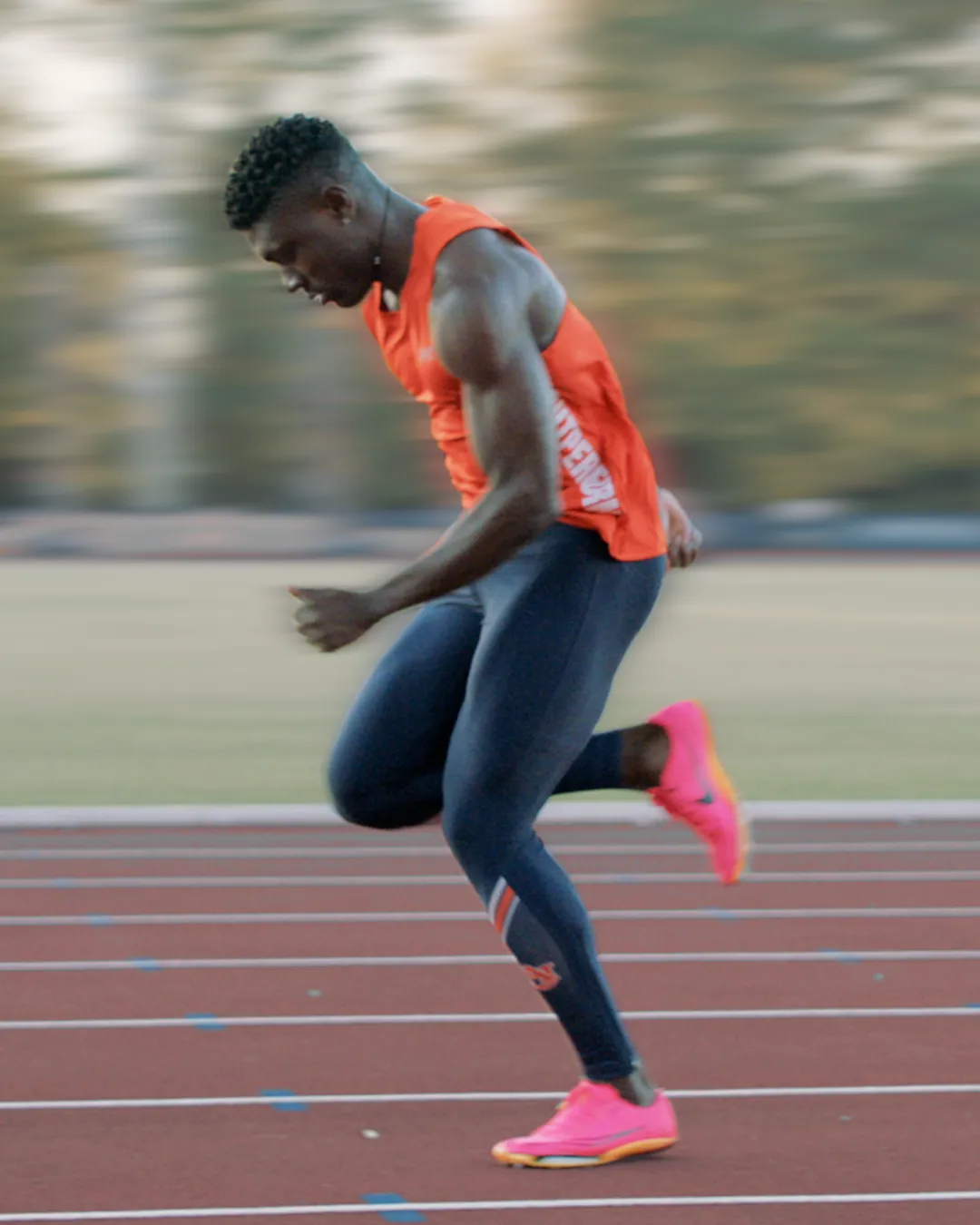 Sprint kinogram frame at full support showing the moment the body passes over the support leg for analysis of hip projection and posture