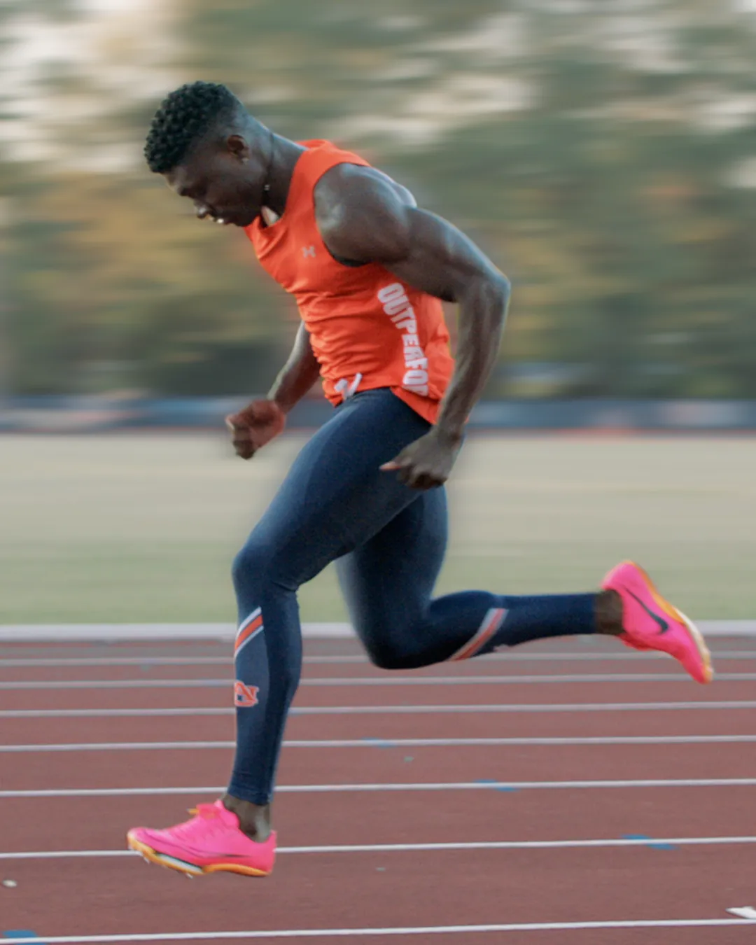 Sprint kinogram position 3 at strike showing the lead leg descending toward ground contact for analysis of touchdown preparation