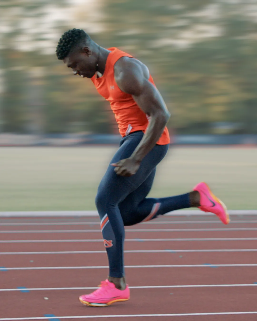 Sprint kinogram position 4 at touchdown showing initial ground contact for analysis of foot strike position and overstriding