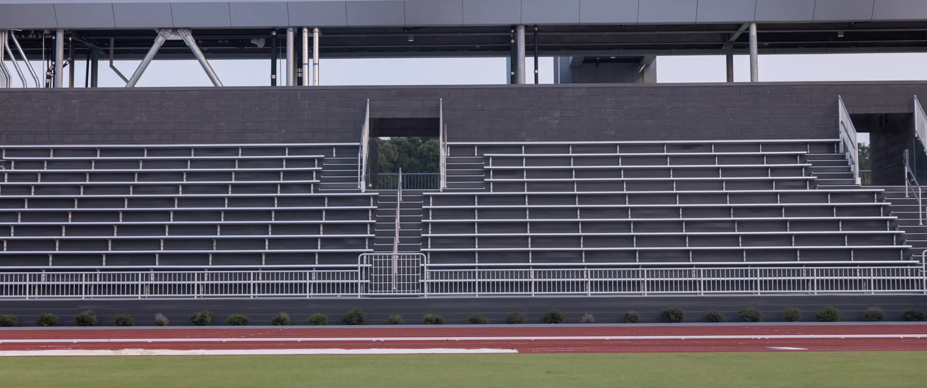 Empty stands and the long jump runway at a stadium
