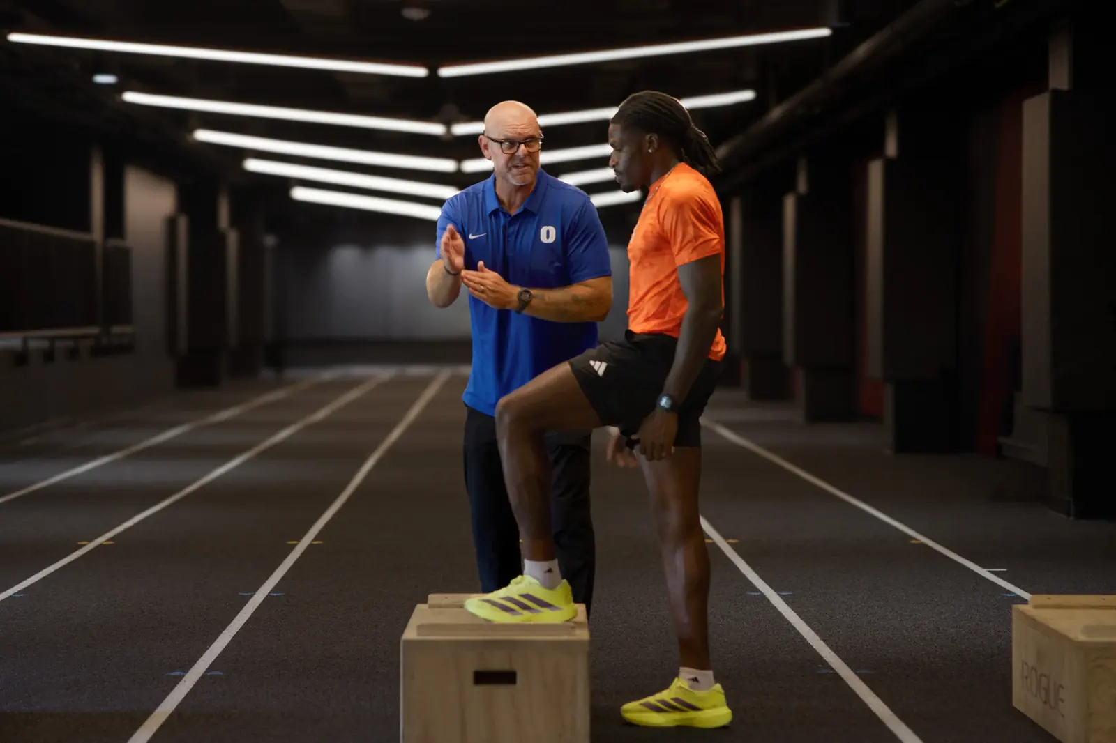 Ryan Baily coaching a jumper on a plyo box